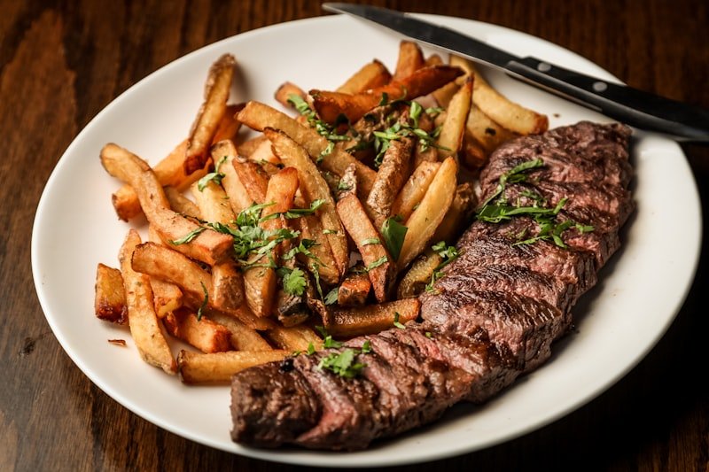 Flame-broiled steak with fries